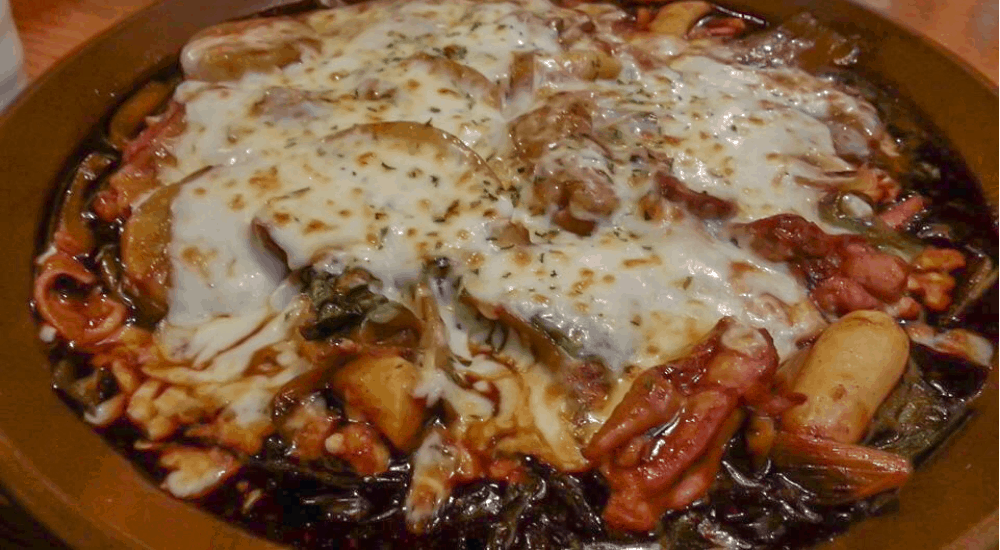 jjimdak with cheese on top of it in wonju, South Korea