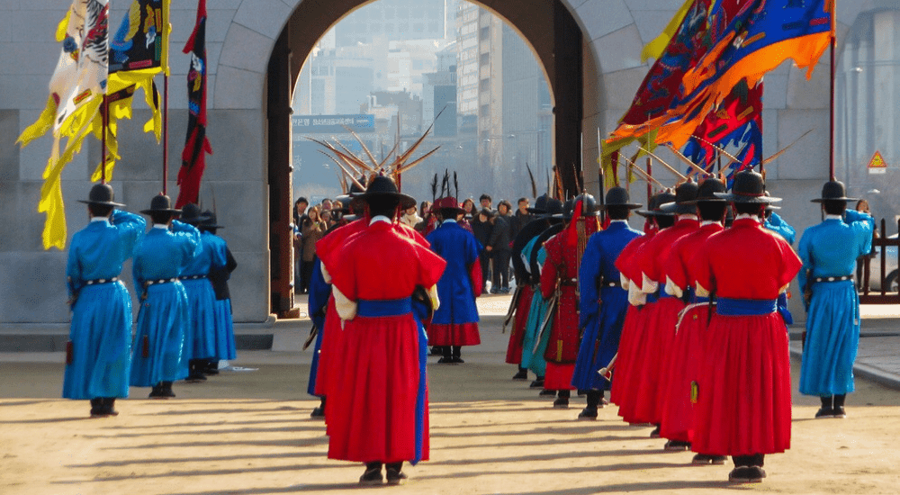 changing of the guards in Seoul South Korea. The guards are holding their flags