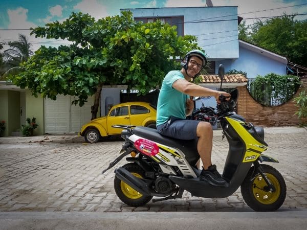 Puerto escondido riding around on a scooter