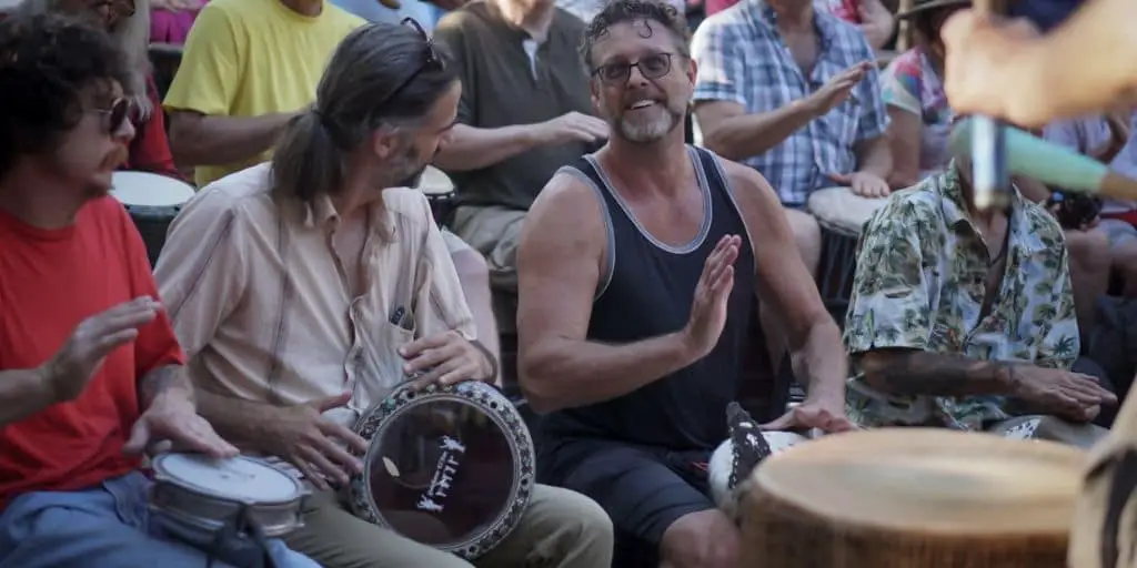 3 guys playing drums at the Drum Circle in Asheville North Carolina on Friday Nights