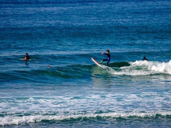 a surfer at the zurriola beach in san sebastian