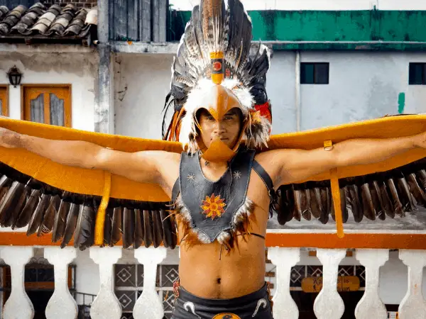 A Dancer posing for a picture before the Dance of the Flyers in Cuetzalan, Mexico